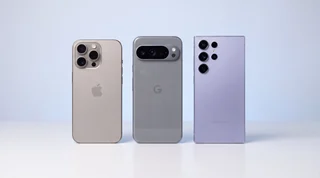 A refurbished iPhone and Google Pixel lying side by side on a clean studio surface, seen from above